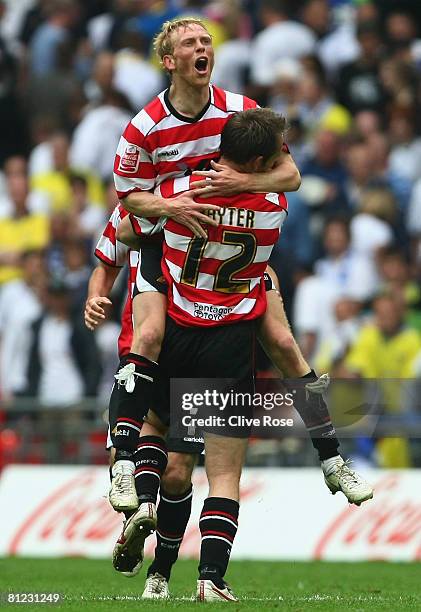 James Hayter of Doncaster Rovers and team mate Paul Green celebrate victory following the Coca Cola League 1 Playoff Final match between Leeds United...