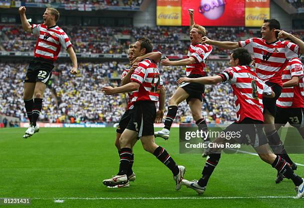 James Hayter of Doncaster Rovers celebrates with team mates as he scores their first goal during the Coca Cola League 1 Playoff Final match between...