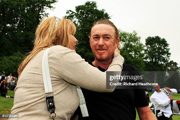 Miguel Angel Jimenez of Spain celebrates winning the BMW PGA Championship with his wife Monserrat after the 2nd playoff hole on the 18th green during...