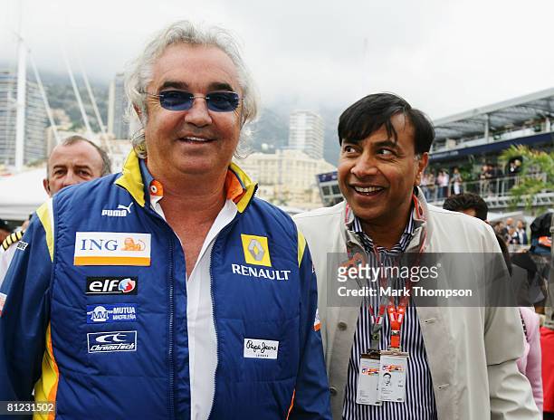 Renault F1 Team Principal Flavio Briatore and billionaire industrialist Lakshmi Mittal arrive in the paddock before the Monaco Formula One Grand Prix...