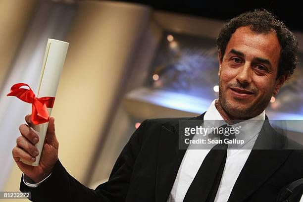 Director Matteo Garrone accepts the Grand Prize for the movie 'Gomorra' during the Palme d'Or Closing Ceremony at the Palais des Festivals during the...