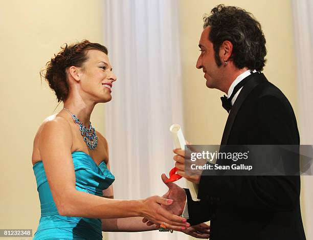 Director Paolo Sorrentino accepts from actress / model Milla Jovovich the Jury Prize for the movie 'Il Divo' during the Palme d'Or Closing Ceremony...