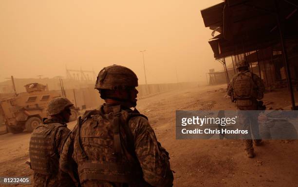 Army Lt. Col. Michael Pemrick, the deputy commander of the 3rd Brigade Combat Team of the 4th Infantry Division walks with members of his troop...