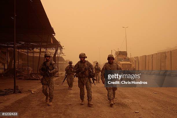 Army Lt. Col. Michael Pemrick, the deputy commander of the 3rd Brigade Combat Team of the 4th Infantry Division walks with members of his troop...