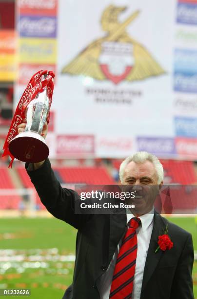 John Ryan chairman of Doncaster Rovers celebrates with the trophy following the Coca Cola League 1 Playoff Final match between Leeds United and...