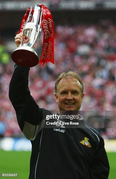 Sean O'Driscoll manager of Doncaster Rovers celebrates with the trophy following the Coca Cola League 1 Playoff Final match between Leeds United and...