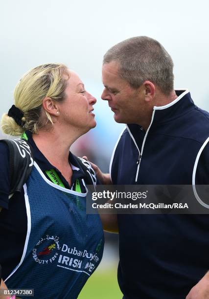 David Drysdale of Scotland kisses his wife and caddy Vicky Drysdale after finishing his course record round and qualifying for The Open at Royal...