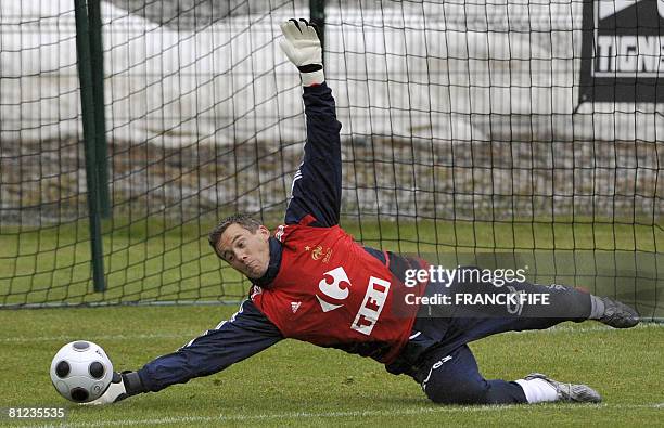 French football national team's goalkeaper Mickael Landreau stops a ball during a training session in preparation for the upcoming Euro 2008, on May...