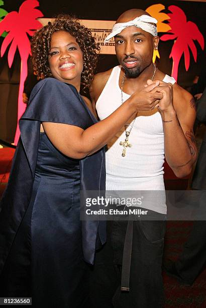 Oprah Winfrey impersonator Carol Woodle of California and Tupac Shakur impersonator Josh Harraway of California pose at a reception prior to the 17th...