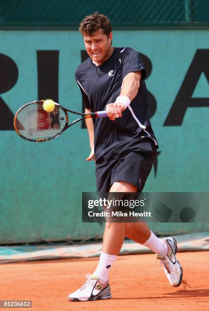 Michael Berrer of Germany hits a backhand during the Men's Singles first round match against Marcel Granollers of Spain on day two of the French Open...