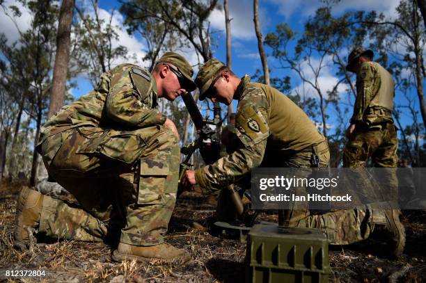 Michael Townsend and PFC Nicholas Naber from the 3rd Battlion 21st Infantry Regiment of the 1st Stryker Brigade Combat Team man their 60mm mortar...