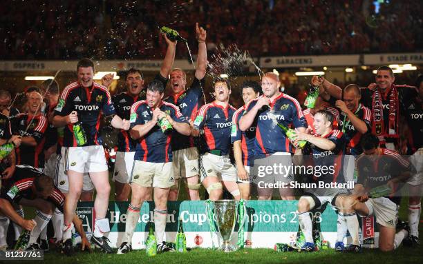 The Munster players celebrate with the trophy following victory in the Heineken Cup Final between Munster and Toulouse at the Millennium Stadium on...