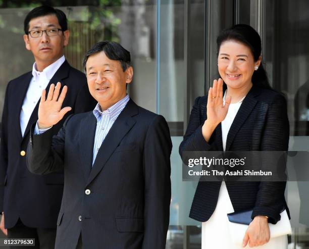 Crown Prince Naruhito and Crown Princess Masako wave to well-wishers on arrival at the Akita Airport on July 10, 2017 in Akita, Japan.