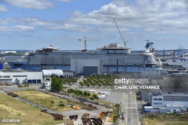 This photo taken on June 25, 2017 in Saint-Nazaire shows the dockyard for the construction of the Oasis 4, slated to become the biggest cruise ship...