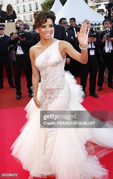 Actress Eva Longoria Parker waves at the cowds as she arrives to attend the screening of US directors John Stevenson and Mark Osborne's animated film...