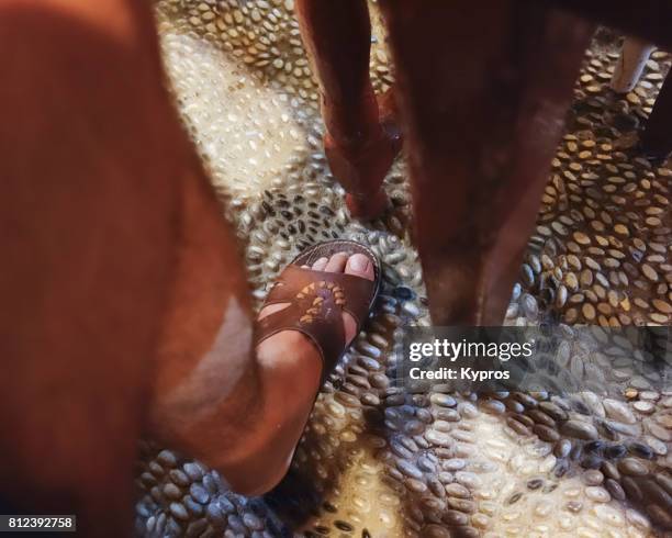 europe, greece, rhodes island, old town, view of male foot with sandals on pebble flooring within turkish cafe. the building is said to be 700 years old - pebble island - fotografias e filmes do acervo