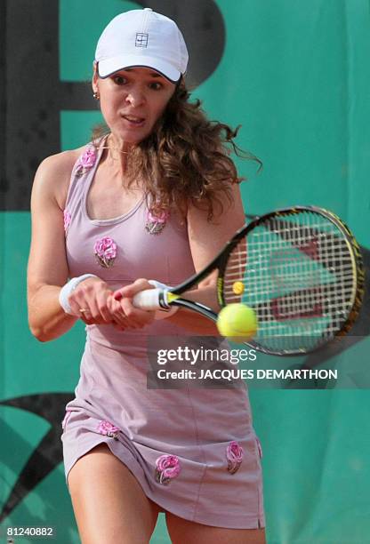 Russian player Galina Voskoboeva eyes the ball for a return to her French opponent Youlia Fedossova during their French tennis Open first round match...