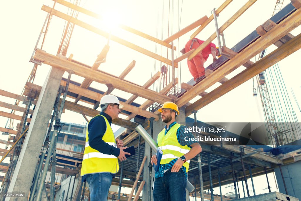 Engineers having meeting regarding new construction phase