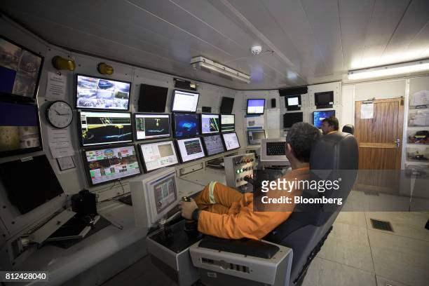 Operators watch screens showing radar scans, maps and camera images in the control room as the 'crawler' machine sucks up sediment from the seabed...