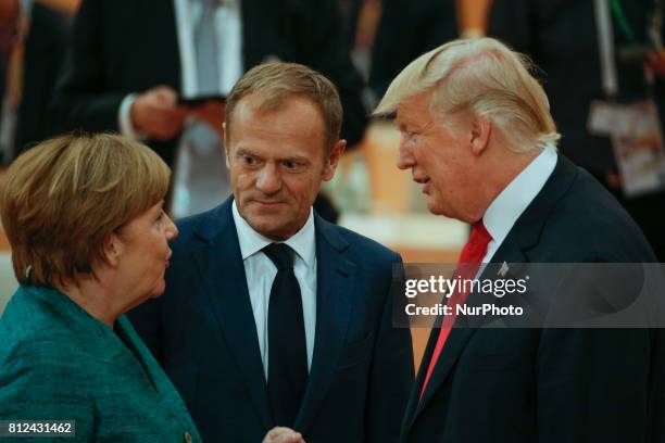 President of the European Council Donald Tusk is seen speaking to US president Donald Trump and German chancelllor Angela Merkel ahead of the thrid...