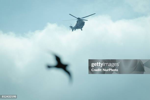 Helicopter is seen flying through a window of the Hamburg Messe congress center where the G20 summit is held in on 8 July, 2017.