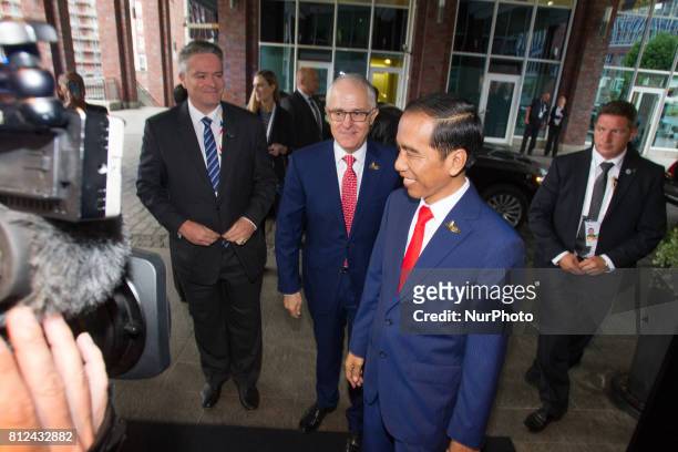Australian PM Malcolm Turnbulli is seen being greeted by Indonesian president Widodo upon arrival at the Steinberger hotel during the G20 summit on 7...