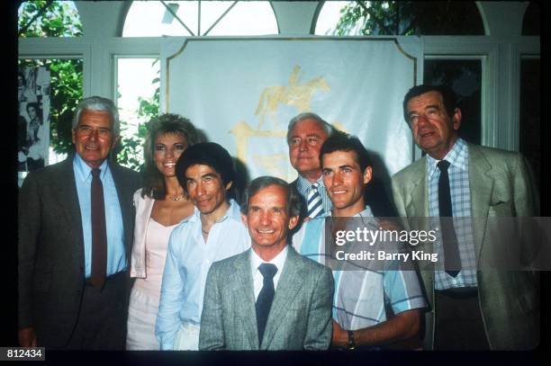 John Forsythe, Vanna White, Laffit Pincay Jr., Willie Shoemaker, Merv Griffin, Gary Stevens and Walter Matthau pose at a celebration for the fiftieth...