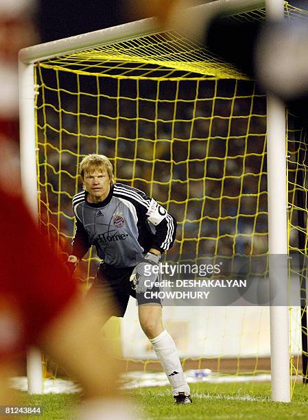 German League and Cup champions Bayern Munich goalkeeper and captain Oliver Kahn mans his post during a friendly match between Bayern Munich and...