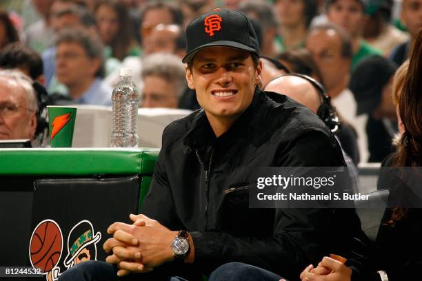 New England Patriots quarterback Tom Brady sits courtside as the Boston Celtics take on the Cleveland Cavaliers in Game Seven of the Eastern...