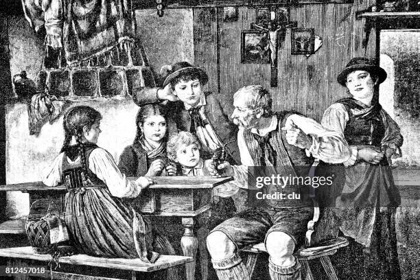 grandfather with pipe sitting at table, surrounded by children, telling fairy tales - leather journal stock illustrations