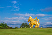 Singha statue at Singha Park, Chiangrai, Thailand. Gold Lion statue in Boonrawd farm. Popular and famous in vacation for tourist.