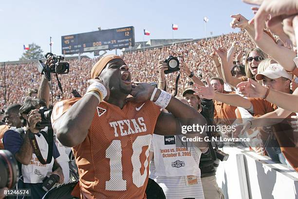 Vince Young of the Texas Longhorns celebrates with fans after defeating the Oklahoma Sooners in the 100th annual Red River Rivalry at the Cotton Bowl...