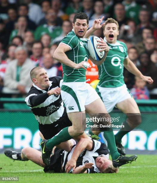 Rob Kearney of Ireland is tackled by Jaco Pretorius of the Barbarians during the International Friendly match between the Barbarians and Ireland at...