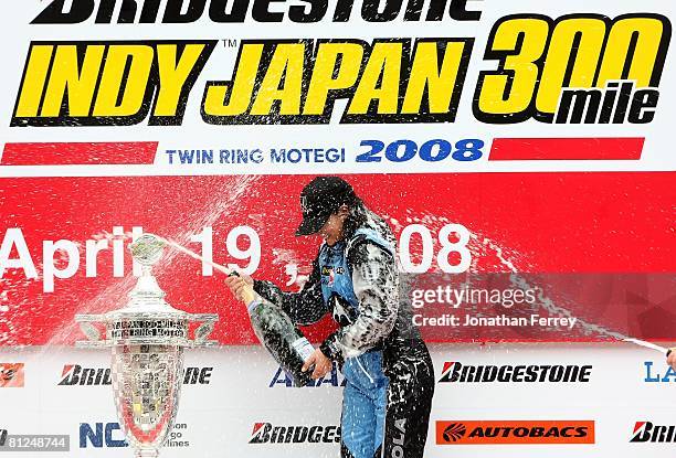 Danica Patrick driver of the Motorola Andretti Green Racing Honda Dallara sprays champagne after winning the IndyCar Series Bridgestone Indy Japan...