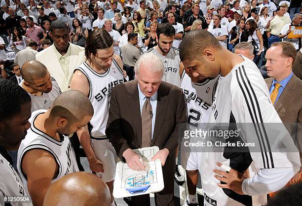 Gregg Popovich, Head Coach of the San Antonio Spurs, talks strategy to his team before the game starts against the Los Angeles Lakers in Game Four of...