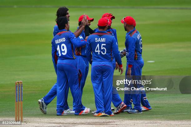 Shapoor Zadran of Afghanistan celebrates with team mates after claiming the wicket of Brendon McCullum of MCC hits out during the MCC v Afghanistan...