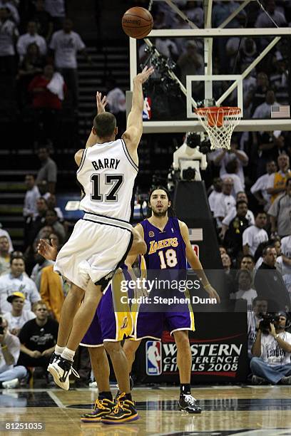 Brent Barry of the San Antonio Spurs shoots and misses the final shot over Derek Fisher of the Los Angeles Lakers in Game Four of the Western...