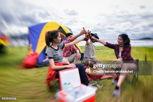 group of man and woman enjoy traveling with convertible off road car, sky cleared in background . holiday , vacation , summer concept . - campfire stories stock pictures, royalty-free photos & images