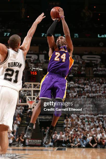 Kobe Bryant of the Los Angeles Lakers shoots over Tim Duncan of the San Antonio Spurs in Game Four of the Western Conference Finals during the 2008...
