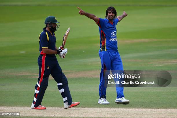 Shapoor Zadran of Afghanistan celebrates after taking the wicket of Misbah-ul-Haq of MCC during the MCC v Afghanistan cricket match at Lord's Cricket...