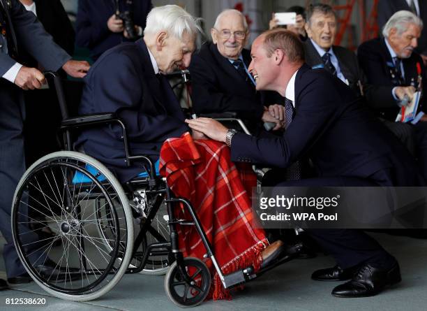 Prince William, Duke of Cambridge talks to Battle of Britain veteran 99 year old Ken Wilkinson during a visit to The Battle Of Britain Memorial...