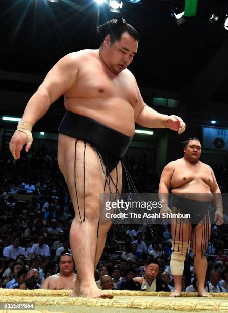 Mongolian yokozuna Kakuryu reacts after his defeat by Hokutofuji during day three of the Grand Sumo Nagoya Torunament at Aichi Prefecture Gymnasium...