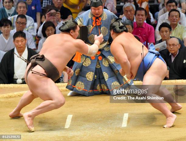 Mongolian yokozuna Hakuho slaps Shodai in their bout during day three of the Grand Sumo Nagoya Torunament at Aichi Prefecture Gymnasium on July 11,...