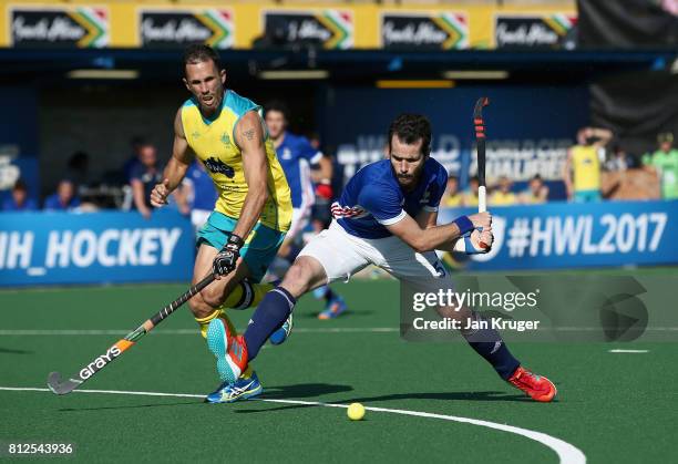 Jean-Laurent Kieffer of France attemps a shot at goal under pressure from Mark Knowles of Australia during day 2 of the FIH Hockey World League Semi...