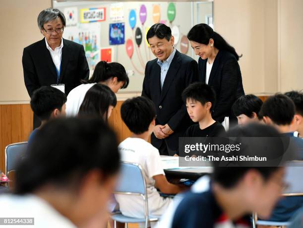 Crown Prince Naruhito and Crown Princess Masako talk with school children at Otoyo Elementary School on July 11, 2017 in Katagami, Akita, Japan.