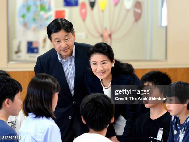 Crown Prince Naruhito and Crown Princess Masako talk with school children at Otoyo Elementary School on July 11, 2017 in Katagami, Akita, Japan.