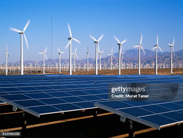 wind turbines and solar panels - california power lines stock pictures, royalty-free photos & images