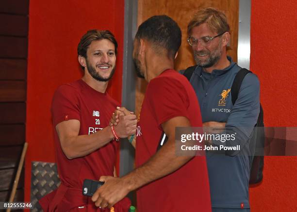 Kevin Stewart of Liverpool with Adam Lallana of Liverpool on his return to Melwood for his first day back at Melwood Training Ground on July 11, 2017...