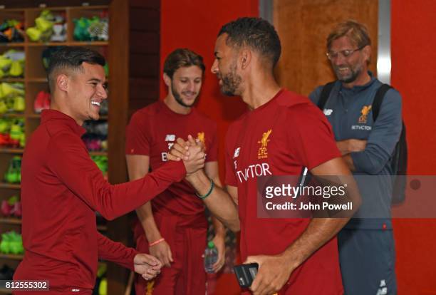 Philippe Coutinho of Liverpool with Kevin Stewart of Liverpool on Philippes return to Melwood for his first day back at Melwood Training Ground on...