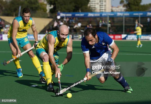 Pieter van Straaten of France and Matthew Swann of Australia battle for possession during day 2 of the FIH Hockey World League Semi Finals Pool A...